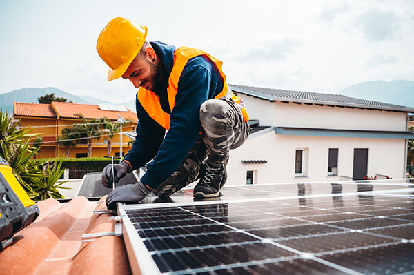 workers-assemble-solar-panel